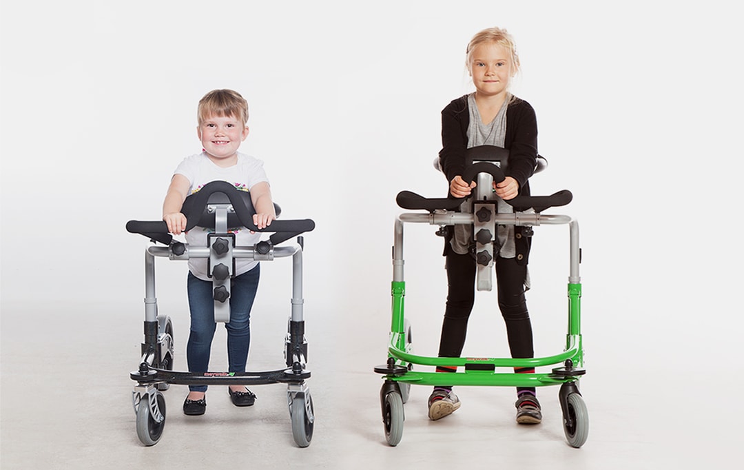 Gait trainer for children - two children training their walk